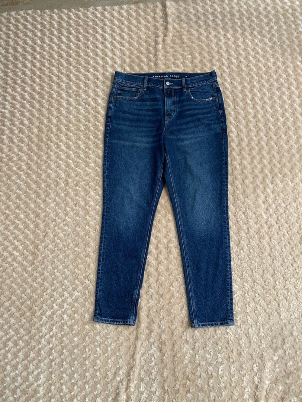American Eagle  Women 14 90's Skinny jeans in a medium wash blue.